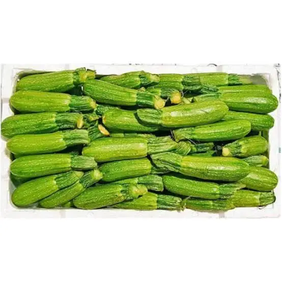 Box of fresh baby marrow vegetables, ideal for healthy cooking.