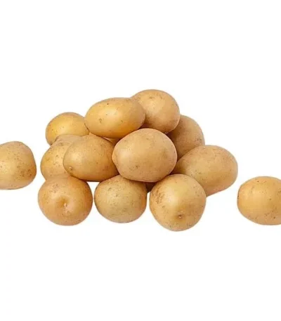 Pile of small, golden baby potatoes on a white background