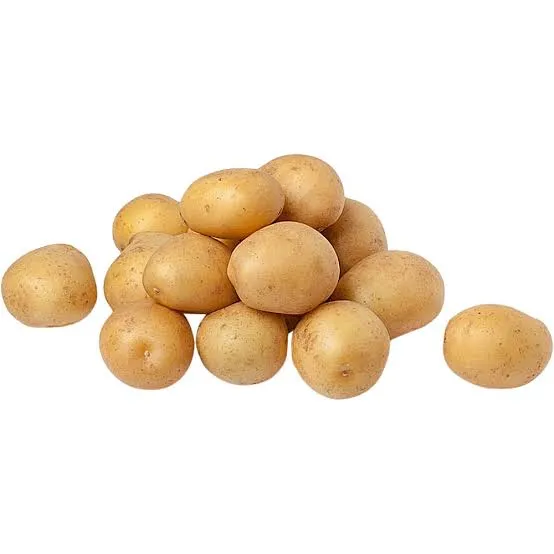 Pile of small, golden baby potatoes on a white background